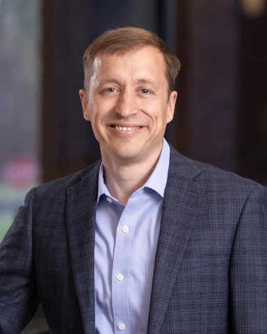 portrait of a smiling person in professional attire